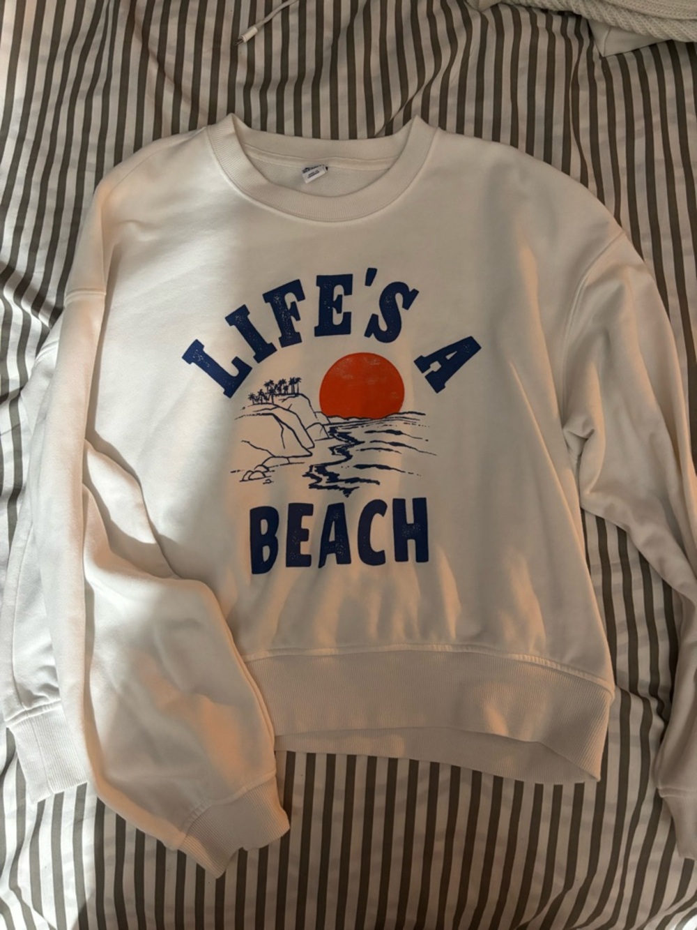 Old Navy White Crewneck Sweatshirt with Blue Text & Orange Sun Graphic